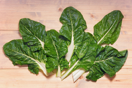 Blitva ( chard leaves ) - popular leafy vegetables in Balkan cuisine. White rustic background, flat layの写真素材