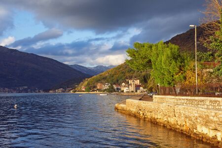 Sunny autumn day in Mediterranean village. Montenegro, Tivat. View of Bay of Kotor and Donja Lastva villageの写真素材