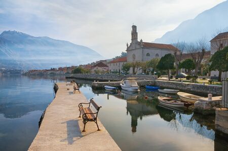 Beautiful winter Mediterranean landscape. Montenegro, view of Bay of Kotor and Prcanj town with St. Nicholas Churchの写真素材