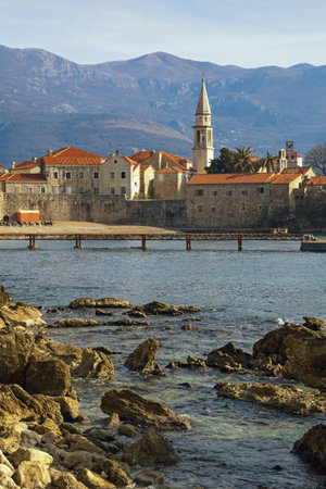 Beautiful winter Mediterranean landscape. Montenegro, Adriatic Sea. View of Old Town of Budva and bell tower of Church of St. Johnのeditorial素材