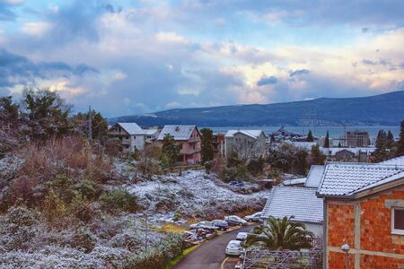 Unusual weather. Snow in Mediterranean village in spring. Montenegro, Kotor Bay, Tivat, Seljanovo villageの写真素材