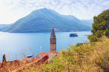 Beautiful autumn Mediterranean landscape. Montenegro, Adriatic Sea. View of Kotor Bay and Perast town. Bell tower of the church of St. Nicholas. Island of Saint George. Travel and tourism conceptの写真素材