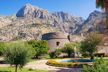 Montenegro, Kotor city.  View of Old Town of Kotor on sunny autumn day.  Square with fountain  near walls of ancient fortifications, Kampana Towerの写真素材