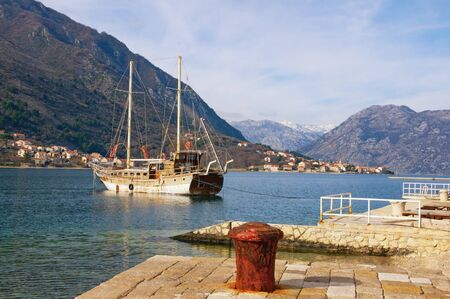 Beautiful winter Mediterranean landscape. Montenegro, Adriatic Sea. View of Bay of Kotor.  View of Prcanj town from town of Dobrota ( near Kotor city )の写真素材