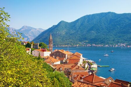 View of ancient town of Perast with bell tower of St. Nicholas Church on sunny autumn day. Montenegro, Adriatic Sea, Bay of Kotorの写真素材