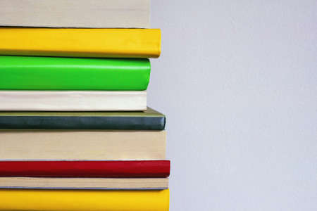 Vertical stack of colorful books. Free space for textの写真素材