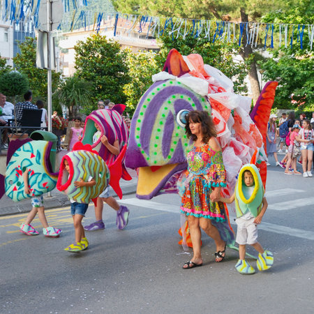 Tivat / Montenegro - June 03 2019: International Summer Carnival in Tivat. Children's parade. Participants of Carnival in costumes of fishes with concept of ecological pollution of seaのeditorial素材