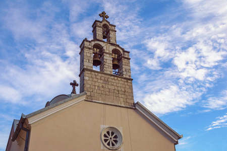 Religious architecture. Montenegro, Herceg Novi, Djenovici village. Bell tower of St. Spyridon Church against skyの写真素材