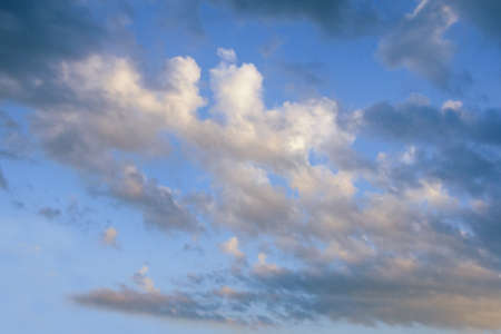 White and dark clouds on blue sky, backgroundの写真素材