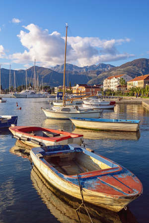 Autumn Mediterranean landscape. Fishing boats on water. Montenegro, Adriatic Sea. View of Bay of Kotor near Tivat cityの写真素材