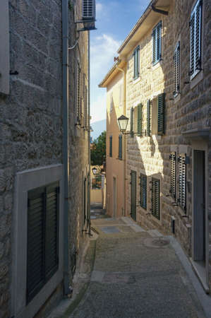 Old narrow street in Mediterranean city. View of Old Town of Herceg Novi. Montenegroの写真素材