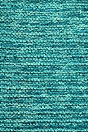 Knitting. Blue-green background, homemade knitted textureの写真素材