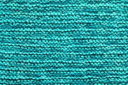 Blue-green background, homemade wool knitted textureの写真素材