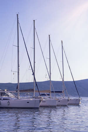 Row of sail boats on water, geometry in landscape. Montenegro, Adriatic Sea, Bay of Kotorの写真素材