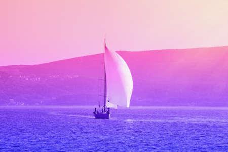Sailing boat on the water, gradient toning. Montenegro, Bay of Kotor. Travel conceptの写真素材