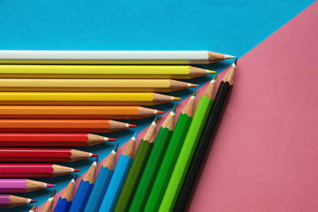 Colored pencils on colored paper. Flat lay, copy spaceの写真素材