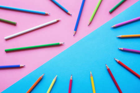 Colored pencils on colored paper. Free space for textの写真素材
