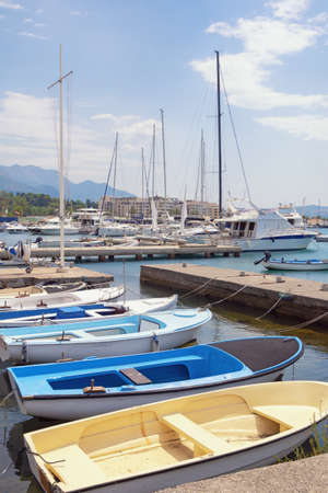 Yachts and fishing boats in harbor, summer Mediterranean landscape. Montenegro, Bay of Kotor near city of Tivatの写真素材