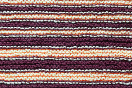 Striped background, homemade wool knitted texture