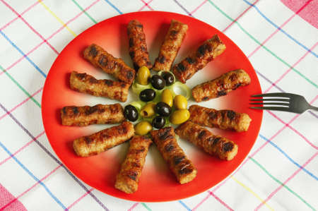 Balkan cuisine. Cevapi - grilled dish of minced meatの写真素材