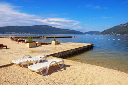 Beach vacation.  Beautiful Mediterranean landscape on sunny autumn day. Montenegro, Adriatic Sea. View of Bay of Kotor near Tivat cityの写真素材
