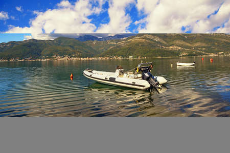 Autumn Mediterranean landscape. Montenegro, Adriatic Sea. View of Kotor Bay near Tivat city. Scenic clouds are reflected in waterの写真素材