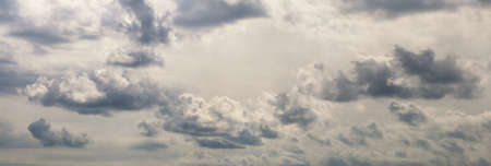 Beautiful row of clouds against the gray sky. Cloudy weatherの写真素材