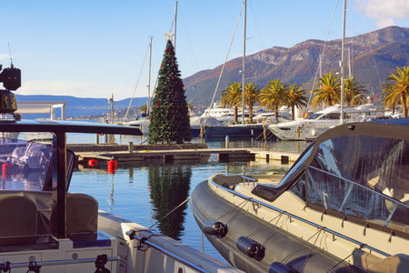 Tivat / Montenegro - December 13 2020:  Christmas Tree in yacht marina. View of Porto Montenegro Marina in Tivat city on sunny winter day. Montenegro, Adriatic Sea, Kotor Bayのeditorial素材