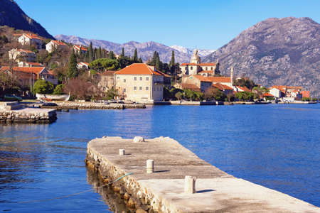 Beautiful winter Mediterranean landscape. View of ancient town of Prcanj. Montenegro, Adriatic Sea, Bay of Kotorの写真素材