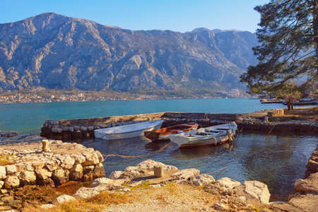 Beautiful winter Mediterranean landscape. Montenegro. View of  Kotor Bay and small harbor for fishing boats near Prcanj townの写真素材