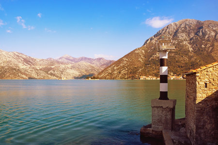 Beautiful Mediterranean landscape on sunny winter day. Montenegro, Adriatic Sea. Beacon on coast of Kotor Bayの写真素材
