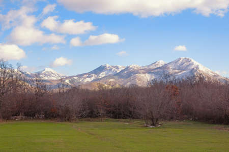 Winter mountain landscape, snow-capped mountains and green grassland. Bosnia and Herzegovina, Republika Srpskaの写真素材