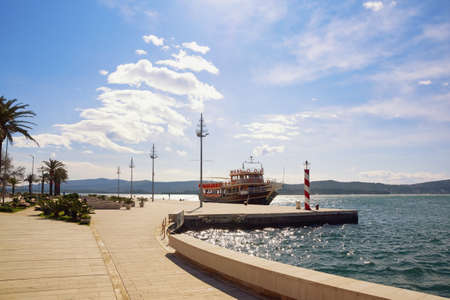 Deserted street of crowded tourist resort, concept of tourism during  pandemic. Montenegro, embankment of Tivat cityの写真素材