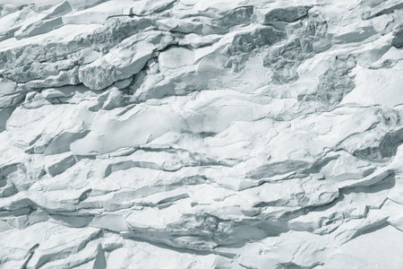 Stone background of light gray slate,  texture of cliffの写真素材