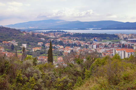 Beautiful spring Mediterranean landscape on cloudy day. View of Tivat city, Montenegroの写真素材