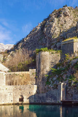Montenegro. Fortress of Old Town of Kotor.  View of southern walls and GurdiÑ Gate on sunny winter dayの写真素材