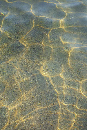 Shallow water on sunny day. Abstract natural textureの写真素材