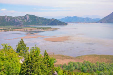 Beautiful wetland landscape. Montenegro, Skadar Lake National Park. View of lake Skadar on spring dayの写真素材