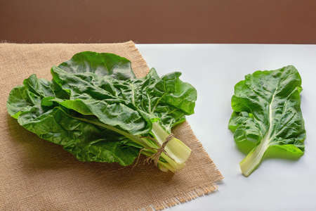 Balkan cuisine. Blitva ( chard leaves ) - popular leafy vegetables on white tableの写真素材