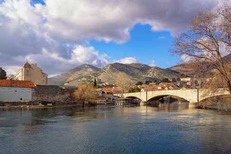 View of Trebinje city  on winter day. Kameni most ( Stone bridge  ) over river TrebiÅ¡njica. Bosnia and Herzegovina, Republika Srpskaの写真素材