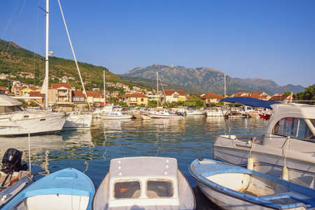 Beautiful Mediterranean landscape. Fishing boats in harbor on sunny summer day. Montenegro,  Bay of Kotor. Tivat city,  view of marina Kalimanjの写真素材