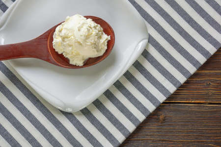 Balkan cuisine. Wooden spoon with kaymak - local soft white cheese.  Montenegroの写真素材