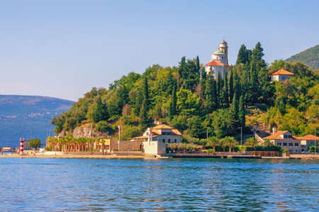 Summer Mediterranean landscape. Montenegro, Adriatic Sea, Bay of Kotor. View of Kamenari village and Church of Sveta Nedjeljaの写真素材