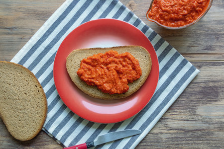 Balkan cuisine. Ajvar - condiment made from bell peppers. Ajvar can be consumed as bread spread.  Free space for textの写真素材