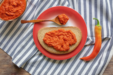 Balkan cuisine. Ajvar - popular condiment, snack, salad, bread spread. Made from  roasted red pepperの写真素材