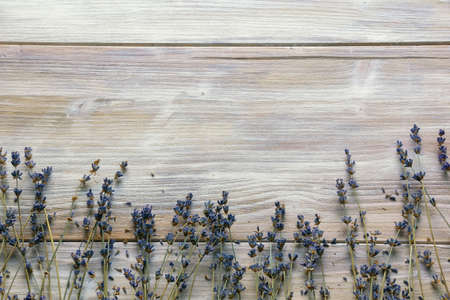 Rustic wooden table with dried lavender flowers. Free space for textの写真素材