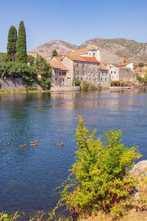 Trebisnjica river near ancient walls of Old Town of Trebinje on sunny autumn day. Bosnia and Herzegovina, Republika Srpskaの写真素材