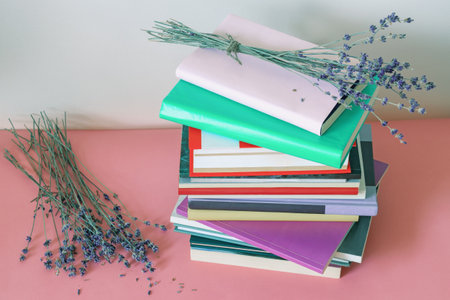 Summer ending,  autumn. Stack of books and dry lavender flowers. Copy spaceの写真素材