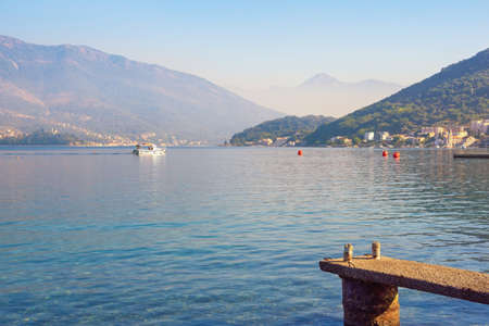 Beautiful  foggy Mediterranean landscape.  Montenegro, Adriatic Sea, view of Bay of Kotor near Tivat city on autumn morningの写真素材