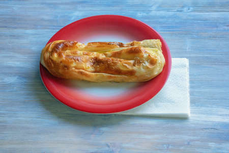Balkan cuisine. Burek ( byrek, borek, bourekas, boreg ) is a baked filled pastries, popular national dish. Rustic background, free space for textの写真素材